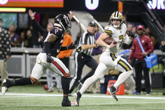 New Orleans Saints Taysom Hill (7) scores a touchdown past Atlanta Falcons safety Ricardo Allen (37). Mandatory Credit: Brett Davis-USA TODAY